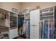 Spacious walk-in closet with custom shelving for optimal organization and storage at 40607 N Candlewyck Ln, Phoenix, AZ 85086