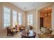 Bright living room features natural light and stylish decor, with plush armchairs, a round coffee table at 40607 N Candlewyck Ln, Phoenix, AZ 85086