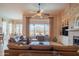 Comfortable living room with a large window overlooking the backyard pool and patio at 40607 N Candlewyck Ln, Phoenix, AZ 85086