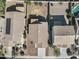 Overhead shot of backyards, with patio covers, fire pits and desert landscaping, showcasing neighborhood layout at 43556 W Colby Dr, Maricopa, AZ 85138