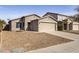 Charming single-Gathering home featuring a two-car garage and low-maintenance desert landscaping at 43556 W Colby Dr, Maricopa, AZ 85138