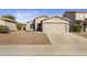 Lovely single-story home boasting a two-car garage, desert landscaping, and welcoming curb appeal at 43556 W Colby Dr, Maricopa, AZ 85138