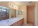 Bathroom featuring double sinks and shower with modern fixtures at 43573 W Blazen Trl, Maricopa, AZ 85138