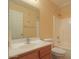 Standard bathroom with a large mirror, vanity, toilet, and shower-tub combo at 43573 W Blazen Trl, Maricopa, AZ 85138