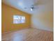 Bright bedroom with hardwood floors and vaulted ceiling at 43573 W Blazen Trl, Maricopa, AZ 85138