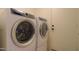 Updated laundry room includes modern side-by-side washer and dryer at 43573 W Blazen Trl, Maricopa, AZ 85138