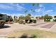 Well maintained community area with shuffleboard court, seating and greenery at 4630 N 68Th St # 253, Scottsdale, AZ 85251