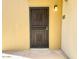 The entrance of a unit with security door, light fixture and unit number 253 at 4630 N 68Th St # 253, Scottsdale, AZ 85251