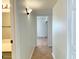 Hallway features tiled flooring, neutral paint and access to rooms; note the attractive wall lighting at 4630 N 68Th St # 253, Scottsdale, AZ 85251