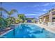 Beautiful pool area featuring tropical landscaping and an outdoor kitchen, great for relaxation and entertaining at 4750 S Rhodium Ln, Mesa, AZ 85212