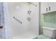 Bathroom featuring a glass enclosed shower, toilet, and small storage cabinet at 5043 W Christy Dr, Glendale, AZ 85304