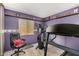 This room is a fully equipped home gym, featuring an exercise bike and a treadmill for a comprehensive workout experience at 5043 W Christy Dr, Glendale, AZ 85304