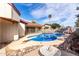 Relaxing outdoor pool area featuring a diving board, desert landscaping, and ample space for poolside lounging at 5043 W Christy Dr, Glendale, AZ 85304