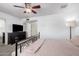 Spacious bedroom featuring a large window and dark wood dresser at 5256 W Port Au Prince Ln, Glendale, AZ 85306