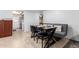 Cozy dining area adjacent to the kitchen, featuring a stylish table and bench seating at 5256 W Port Au Prince Ln, Glendale, AZ 85306