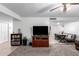 Open concept space with a mix of carpet and tile flooring, connecting the living room and dining area at 5256 W Port Au Prince Ln, Glendale, AZ 85306