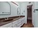 Bathroom with double sinks, wood floors and light-blue walls at 5726 N 10Th St # 5, Phoenix, AZ 85014