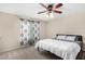 Bedroom with carpet floors, ceiling fan and a large window at 5726 N 10Th St # 5, Phoenix, AZ 85014