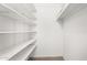 Bright, walk-in closet with white shelving to maximize storage capacity at 5726 N 10Th St # 5, Phoenix, AZ 85014