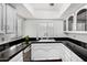 Kitchen featuring black countertops and white cabinetry, with a bright window view at 5726 N 10Th St # 5, Phoenix, AZ 85014