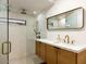 Bright bathroom featuring double shower head, contemporary vanity, and stylish design at 5807 N 18Th St, Phoenix, AZ 85016