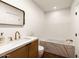 Modern bathroom with a marble countertop and a soaking tub with stylish finishes at 5807 N 18Th St, Phoenix, AZ 85016