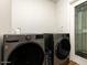 Modern laundry room with gray front loading washer and dryer set at 5807 N 18Th St, Phoenix, AZ 85016