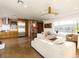 Bright living room featuring exposed brick, modern furnishings, and hardwood floors at 5807 N 18Th St, Phoenix, AZ 85016