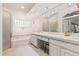 Bright bathroom with double sinks, soaking tub, glass block window, and a separate shower at 5902 S Amberwood Dr, Sun Lakes, AZ 85248