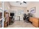 Inviting home office with natural light, a ceiling fan, and ample space for two desks and a bookshelf at 5902 S Amberwood Dr, Sun Lakes, AZ 85248