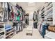 Large walk-in closet with custom shelving and ample storage for clothes, shoes, and accessories at 5902 S Amberwood Dr, Sun Lakes, AZ 85248