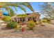 Backyard featuring desert landscaping, a covered patio, and a dining area at 5940 E Taunus Cir, Mesa, AZ 85215