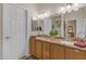 Bathroom with dual sink vanity and great mirror lighting at 5940 E Taunus Cir, Mesa, AZ 85215