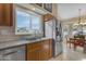 Kitchen with stainless steel appliances and a view into the dining area at 5940 E Taunus Cir, Mesa, AZ 85215