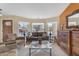 Cozy living room with bay windows and comfortable seating at 5940 E Taunus Cir, Mesa, AZ 85215