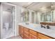 Bathroom features a double sink vanity with wood cabinets and white countertop and a separate room for the toilet at 609 E Mesquite Cir # D131, Tempe, AZ 85288