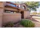 Townhome front exterior with desert landscaping, tiled roof, and private front walkway at 609 E Mesquite Cir # D131, Tempe, AZ 85288