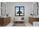 Bright bathroom with dual vanities and a central window offering natural light at 6312 E Calle Del Paisano --, Scottsdale, AZ 85251