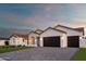 Beautiful garage exterior featuring a large three-car garage with brick pavers at 6312 E Calle Del Paisano --, Scottsdale, AZ 85251