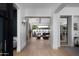 Open hallway featuring wood floors and an open concept view of the Gathering room at 6312 E Calle Del Paisano --, Scottsdale, AZ 85251