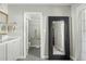 Modern bathroom featuring neutral colors, double vanity, and tiled floors at 6440 E Jean Dr, Scottsdale, AZ 85254