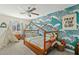 Bright bedroom featuring a unique wave-patterned wall, canopy bed, and a playful, inviting atmosphere at 6440 E Jean Dr, Scottsdale, AZ 85254