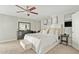 Well-lit bedroom featuring a queen bed, soft neutral colors, and decorative wall art at 6440 E Jean Dr, Scottsdale, AZ 85254