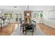 Bright dining room showcasing a wooden table, fireplace, and natural light, offering a welcoming space for meals at 6440 E Jean Dr, Scottsdale, AZ 85254