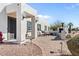 Stylish home exterior with an outdoor grilling area, patio seating, and manicured landscaping at 6440 E Jean Dr, Scottsdale, AZ 85254