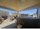 Relax outdoors under a covered patio with a private hot tub and seating area at 650 N Hawes Rd # 3827, Mesa, AZ 85207