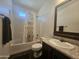 Clean bathroom featuring a shower-tub combo, white tile, a toilet, and a granite vanity at 650 N Hawes Rd # 3827, Mesa, AZ 85207