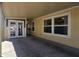 View of the home's covered carport area with double doors and windows at 650 N Hawes Rd # 3827, Mesa, AZ 85207