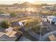 Backyard aerial view with wood fence, tree, and patio, and mountain views at 6601 E Latham St, Scottsdale, AZ 85257