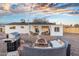 Spacious backyard boasts an outdoor seating area, grill, patio, and new fence at 6601 E Latham St, Scottsdale, AZ 85257